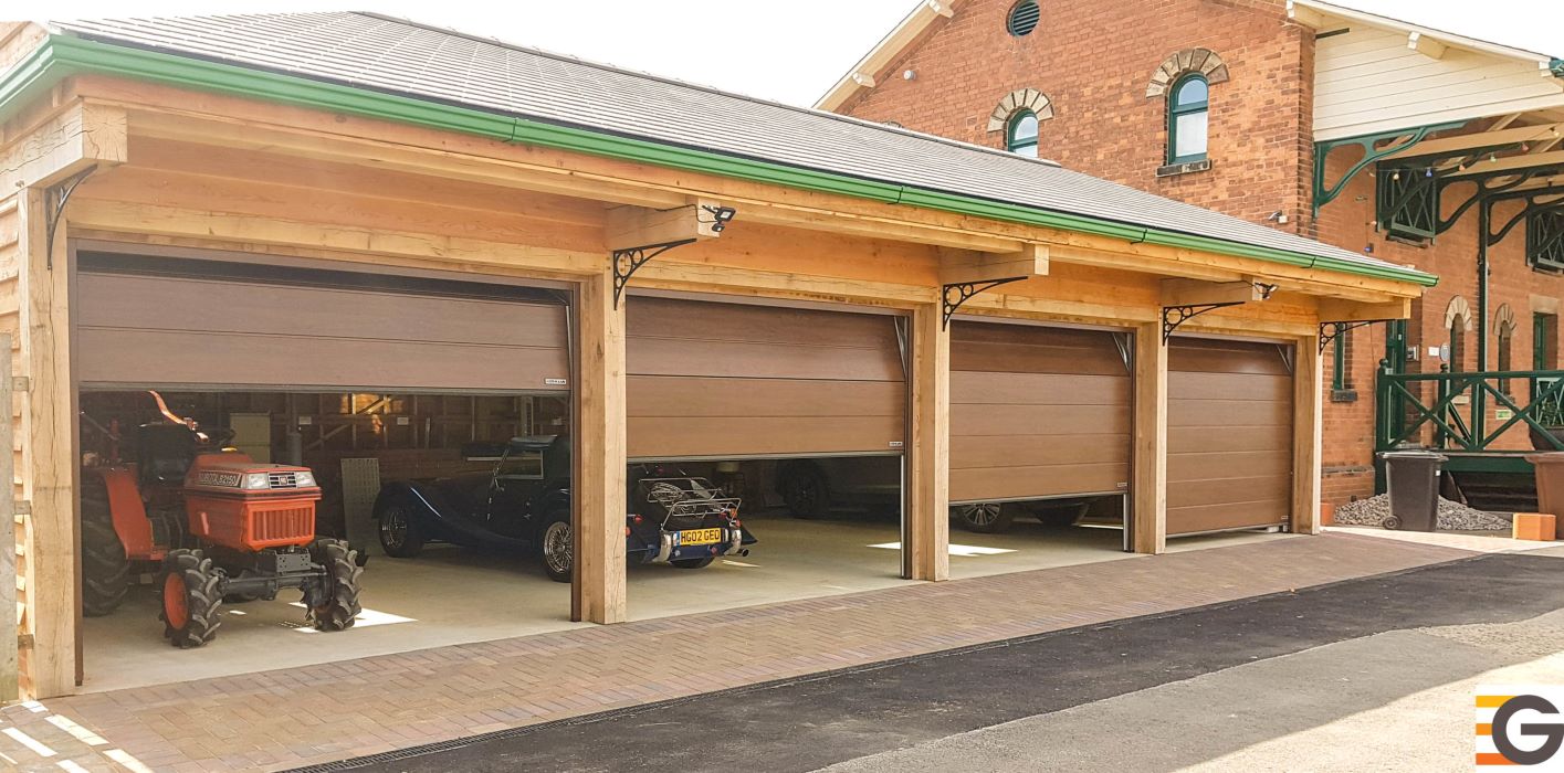 a set of four garage doors within a wooden garage
